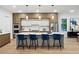 Gourmet kitchen featuring a large island with seating, modern cabinetry, and stainless steel appliances at 1610 Niskey Lake Sw Rd, Atlanta, GA 30331