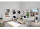 Bright living room with large windows, plush seating, stylish decor, and an inviting, airy atmosphere at 1610 Niskey Lake Sw Rd, Atlanta, GA 30331