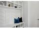 Mudroom with built-in storage, bench, and decorative pillows at 1610 Niskey Lake Sw Rd, Atlanta, GA 30331