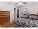 Bedroom with hardwood floors, a double bed, and a dresser at 3189 Bellgreen Way, Decatur, GA 30032