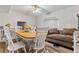 Dining area featuring a table and chairs with a sofa and an archway at 3189 Bellgreen Way, Decatur, GA 30032