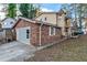 View of the exterior of the home, with a brick facade and attached garage at 3189 Bellgreen Way, Decatur, GA 30032