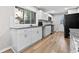 Bright kitchen featuring white cabinets, granite countertops and wood flooring at 3189 Bellgreen Way, Decatur, GA 30032