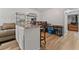 Open kitchen area with island seating, dining table, and living room view at 3189 Bellgreen Way, Decatur, GA 30032