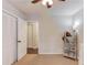 Bedroom features double-door closet and neutral walls at 322 Kibbee Rd, Mcdonough, GA 30252