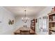 Traditional dining room with chandelier, french doors, and space for large table at 322 Kibbee Rd, Mcdonough, GA 30252