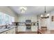 Well-lit kitchen with stainless steel appliances, custom cabinets and backsplash at 322 Kibbee Rd, Mcdonough, GA 30252