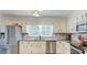 Charming kitchen with stainless appliances and a view to backyard at 322 Kibbee Rd, Mcdonough, GA 30252