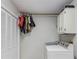 Bright laundry room features folding doors, neutral walls, and a new washing machine at 322 Kibbee Rd, Mcdonough, GA 30252