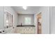 Clean and modern laundry room with sink, cabinets, and stainless refrigerator at 322 Kibbee Rd, Mcdonough, GA 30252