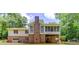 Back of house featuring screened in porch and walk out basement at 322 Kibbee Rd, Mcdonough, GA 30252