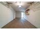 An attached one car garage with shelving at 5255 Biffle Downs Rd, Stone Mountain, GA 30088
