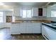 Practical kitchen layout with essential appliances, wood countertops and window views at 5255 Biffle Downs Rd, Stone Mountain, GA 30088