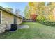 Spacious backyard area with lush grass and patio, ideal for outdoor enjoyment and entertaining at 870 Chapman Cir, Stone Mountain, GA 30088