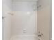 White tiled full bathroom with a standard shower head at 870 Chapman Cir, Stone Mountain, GA 30088