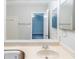 Bathroom sink vanity with a mirror shows a view of another room at 870 Chapman Cir, Stone Mountain, GA 30088