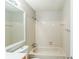 Full bathroom with a white tiled shower, a standard-size mirror, and a white toilet at 870 Chapman Cir, Stone Mountain, GA 30088
