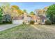 Charming single-story home featuring a stone accent wall and an attached two-car garage at 870 Chapman Cir, Stone Mountain, GA 30088