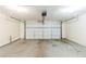 Spacious garage with a roll-up door, offering ample parking and storage space at 870 Chapman Cir, Stone Mountain, GA 30088