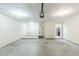 Open garage area leading to the kitchen, with ample room for cars and storage at 870 Chapman Cir, Stone Mountain, GA 30088