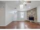Spacious living room with wood floors and a stone fireplace with a stone hearth at 870 Chapman Cir, Stone Mountain, GA 30088