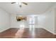 Open-concept living area with wood floors and views of the dining area and kitchen at 870 Chapman Cir, Stone Mountain, GA 30088