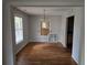 Bright dining room features hardwood floors, natural light, and a view into the kitchen for easy entertaining at 1142 Windsor Sw St, Atlanta, GA 30310