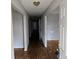 Inviting hallway featuring hardwood floors and neutral paint, creating a clean and bright passageway at 1142 Windsor Sw St, Atlanta, GA 30310