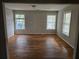 Spacious living room with hardwood floors and plenty of natural light, perfect for relaxing and entertaining at 1142 Windsor Sw St, Atlanta, GA 30310
