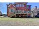 Brick home with deck, patio, and a spacious backyard for entertaining or relaxing at 2505 Weber Heights Way, Buford, GA 30519