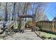 Grassy backyard featuring a stone patio with an ornate stone arbor at 2505 Weber Heights Way, Buford, GA 30519