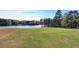 Expansive backyard and lake frontage provides picturesque views, perfect for relaxation at 2505 Weber Heights Way, Buford, GA 30519