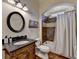 Cozy bathroom featuring a stylish vanity with a granite countertop and bathtub with shower at 2505 Weber Heights Way, Buford, GA 30519