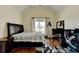 Bedroom with A-frame window, queen-sized bed, and neutral walls at 2505 Weber Heights Way, Buford, GA 30519