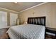 Inviting bedroom showcasing hardwood floors, a large bed, and ample natural light at 2505 Weber Heights Way, Buford, GA 30519