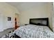 Cozy bedroom with a queen-sized bed, black furniture and neutral walls at 2505 Weber Heights Way, Buford, GA 30519
