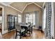 Dining area with high ceilings, designer chandelier, and hardwood floors at 2505 Weber Heights Way, Buford, GA 30519