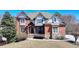 Two-story brick and siding home with covered front entry and lush landscaping at 2505 Weber Heights Way, Buford, GA 30519