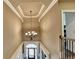 Bright foyer featuring hardwood floors, chandelier and transom windows at 2505 Weber Heights Way, Buford, GA 30519