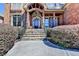 Inviting front entry with stone steps, iron railing, and manicured bushes at 2505 Weber Heights Way, Buford, GA 30519