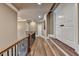 Upstairs hallway with hardwood floors, railing, and trim at 2505 Weber Heights Way, Buford, GA 30519