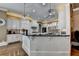 Kitchen featuring white cabinets, granite countertops, stainless steel appliances, and decorative backsplash at 2505 Weber Heights Way, Buford, GA 30519