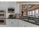 Well-equipped kitchen featuring stainless steel appliances, granite countertops, and a kitchen sink at 2505 Weber Heights Way, Buford, GA 30519