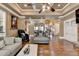 Bright living room with hardwood floors, comfortable seating, fireplace, and elegant decor at 2505 Weber Heights Way, Buford, GA 30519