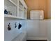 Organized mudroom with built-in storage, hooks, and bench for convenient entry at 2505 Weber Heights Way, Buford, GA 30519