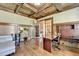 Inviting home office features coffered wood ceiling and large window at 2505 Weber Heights Way, Buford, GA 30519