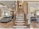 Beautiful staircase with hardwood treads and decorative iron balusters leading to the upper level at 2505 Weber Heights Way, Buford, GA 30519