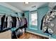 A beautifully designed walk-in closet features custom shelving and natural light at 2505 Weber Heights Way, Buford, GA 30519