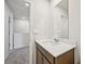 Bathroom featuring a sink with a wood cabinet and quartz countertop at 2770 Aralynn Way, College Park, GA 30337
