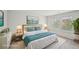 Staged bedroom with large bed, matching nightstands, decor and a coastal inspired print on the wall at 2770 Aralynn Way, College Park, GA 30337
